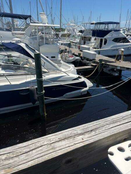 2007 Monterey 350 Sport Yacht docked at a marina with other boats.