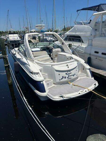 2007 Monterey 350 Sport Yacht docked in marina, surrounded by other boats.