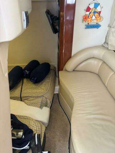 Interior of 2007 Monterey 350 Sport Yacht with beige seating and nautical decor.