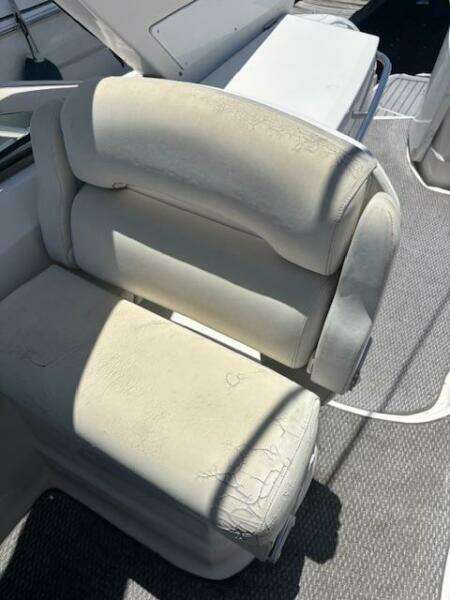 2007 Monterey 350 Sport Yacht seat with light wear, featuring white upholstery and textured flooring.