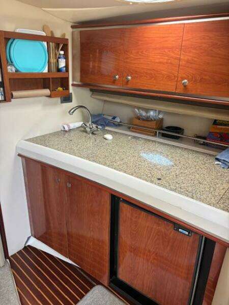 2007 Monterey 350 Sport Yacht kitchen with wood cabinets and granite countertop.