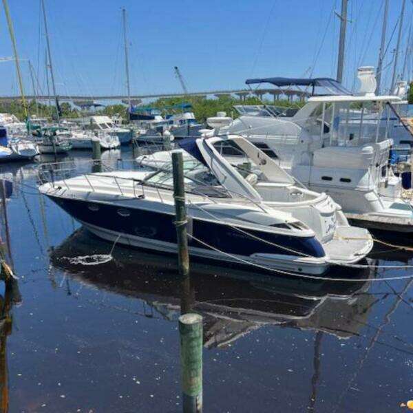 2007 Monterey 350 Sport Yacht docked in a marina, surrounded by other boats.
