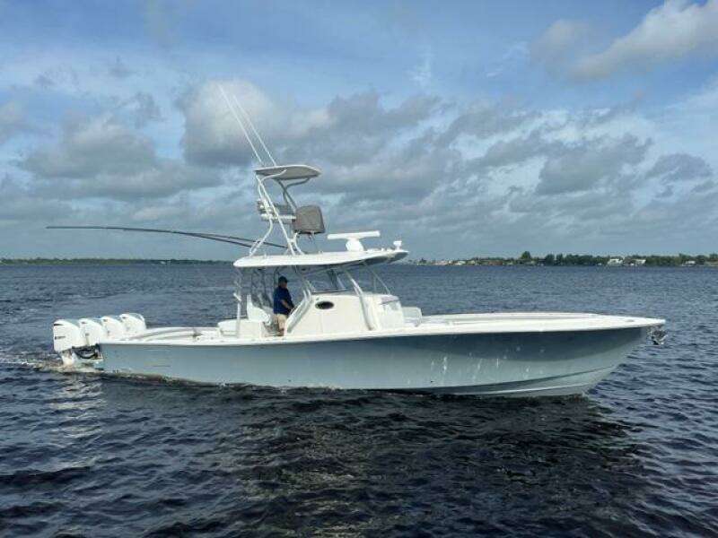 2018 Regulator 41 boat cruising on open water under cloudy skies.