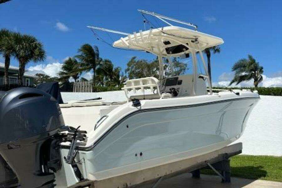 2018 Century 2600 Center Console boat on trailer, with clear blue sky background.