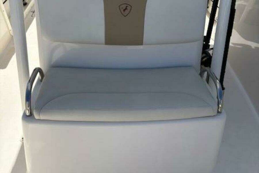 Century 2600 Center Console 2018 boat seat with white upholstery and armrests.