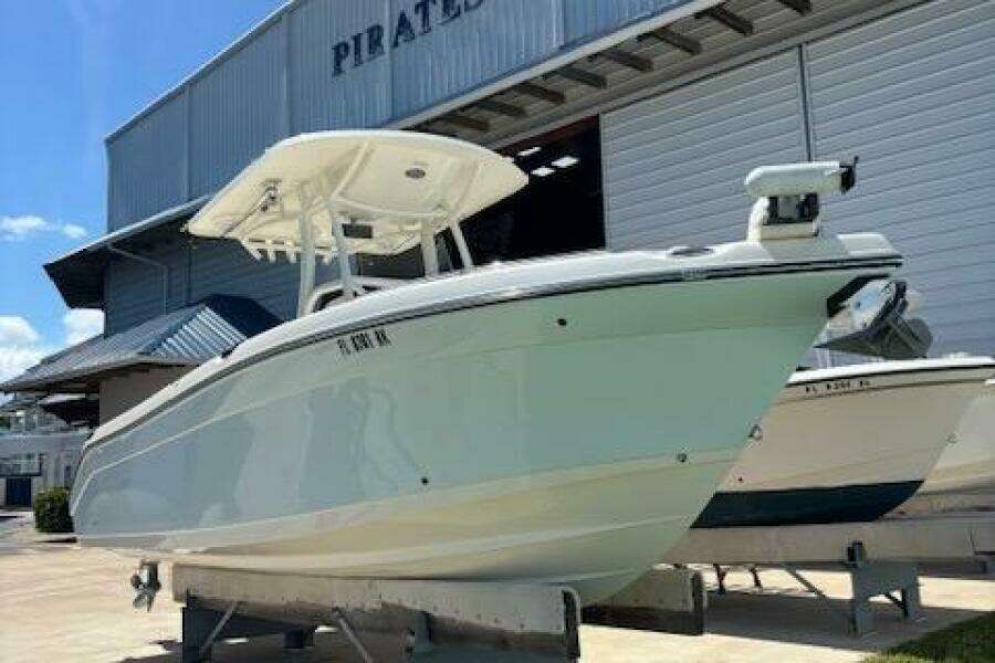 2018 Century 2600 Center Console boat displayed at a marina.