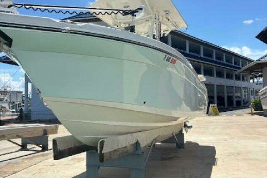 2018 Century 2600 Center Console boat on display at a marina.