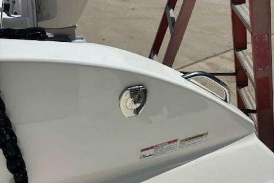 2018 Century 2600 Center Console boat detail with ladder in background.