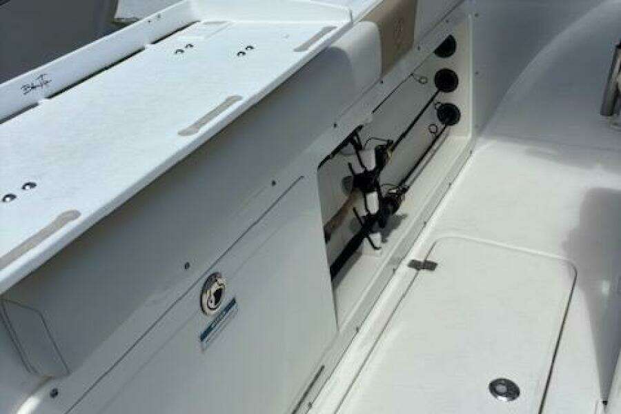 2018 Century 2600 Center Console boat interior with rod holders and storage compartments.