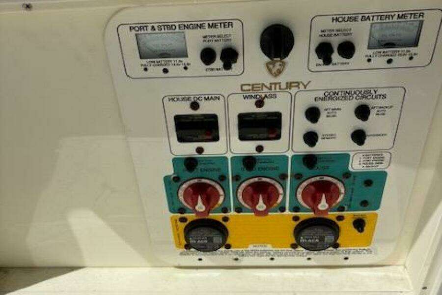 Control panel of a 2018 Century 2600 Center Console boat with various switches and meters.
