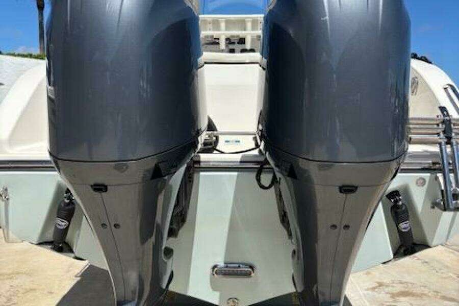 2018 Century 2600 Center Console with dual outboard motors, rear view.