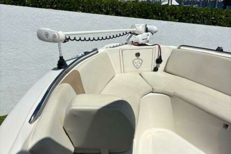 2018 Century 2600 Center Console boat with cushioned seating and mounted equipment.
