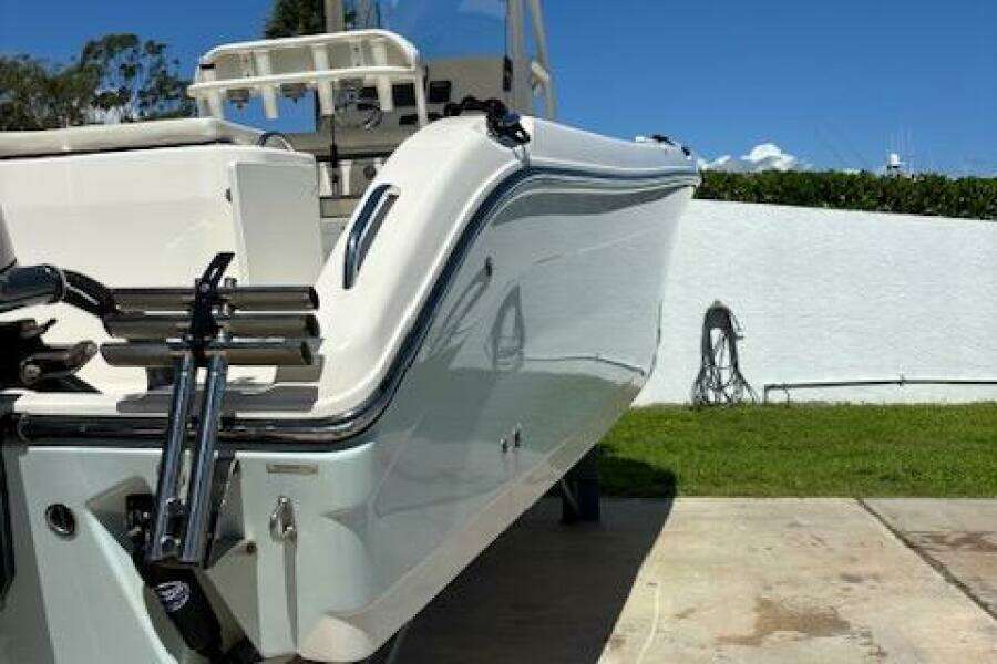2018 Century 2600 Center Console boat on a driveway, sunny day.