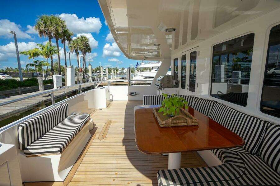 Luxurious 1996 ABD 90 Explorer yacht deck with seating and modern amenities.