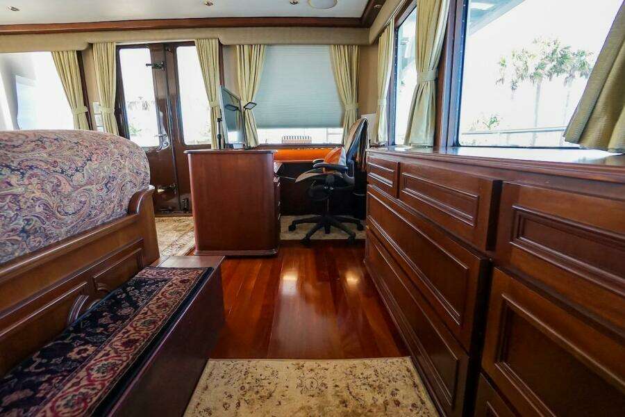 Luxurious interior of 1996 ABD 90 Explorer yacht with wooden furnishings and elegant decor.