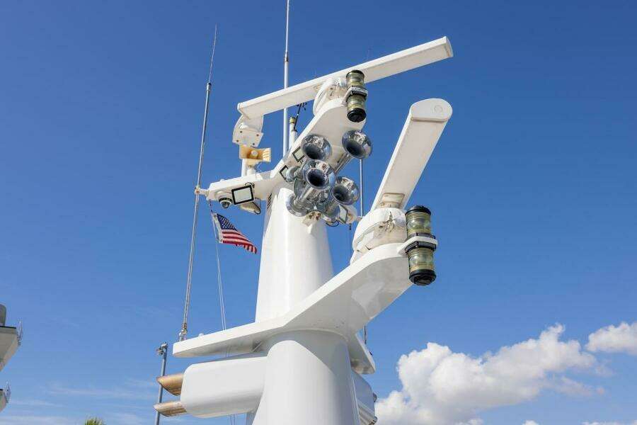 Radar and communication equipment on ABD 90 Explorer yacht, 1996, with American flag.