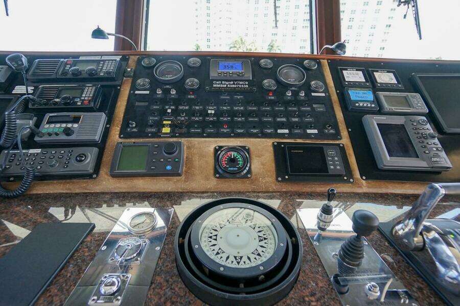 Luxurious 1996 ABD 90 Explorer yacht interior with map and globe decor.