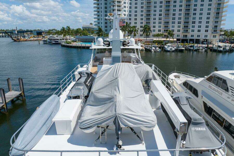 Luxury yacht ABD 90 Explorer 1996 docked at marina with covered equipment.