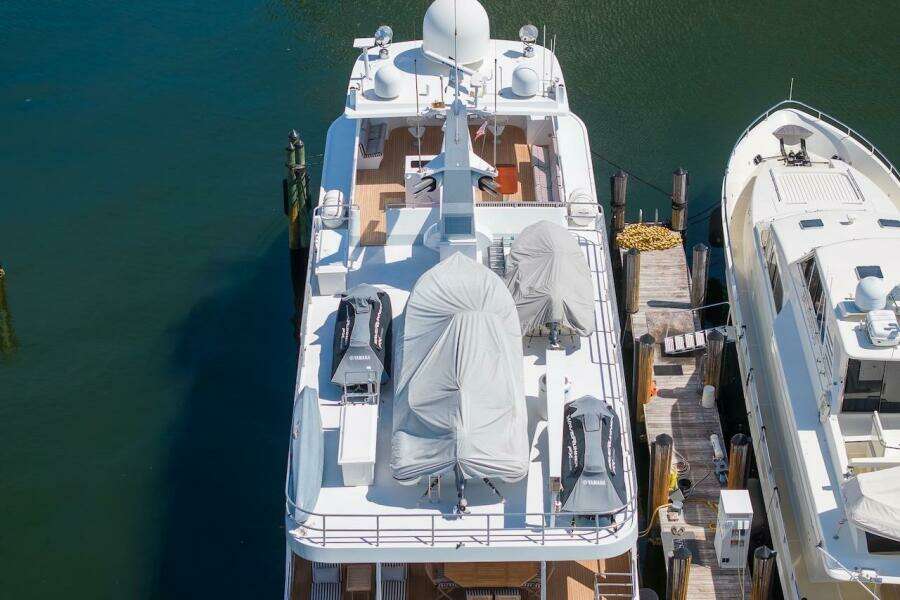 Aerial view of 1996 ABD 90 Explorer yacht docked beside another vessel.