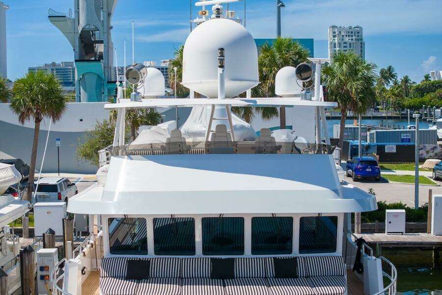 Luxury yacht ABD 90 Explorer, 1996 model, docked in a sunny marina setting.