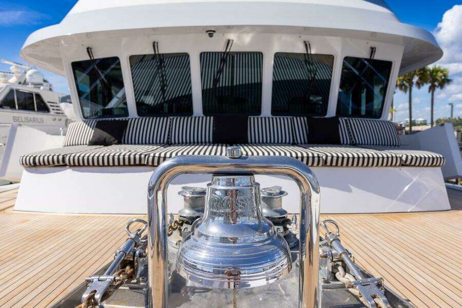 Luxury yacht deck with striped seating and polished bell, ABD 90 Explorer, 1996 model.
