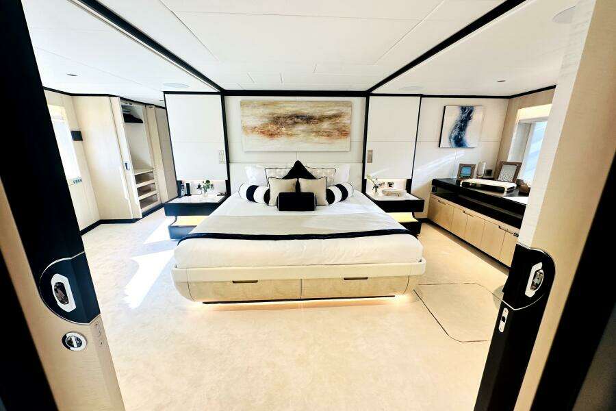 Luxurious bedroom interior on 2023 Majesty 120 yacht, featuring modern design and elegant decor.