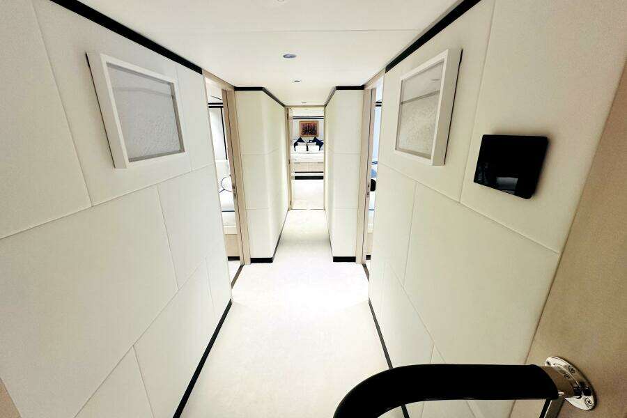 Luxurious hallway interior of 2023 Majesty 120 yacht, featuring modern design and elegant decor.