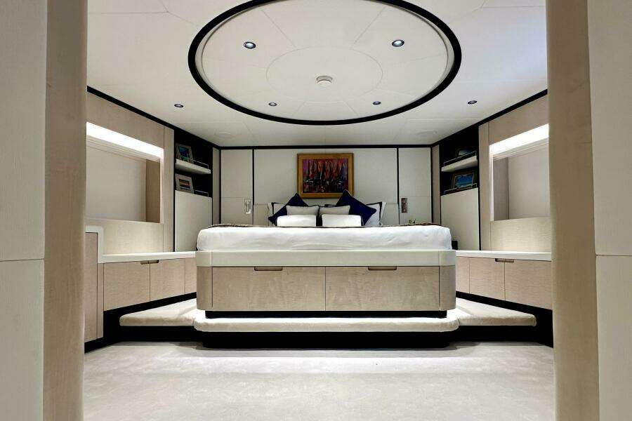 Luxurious bedroom interior of 2023 Majesty 120 yacht with modern design and elegant furnishings.