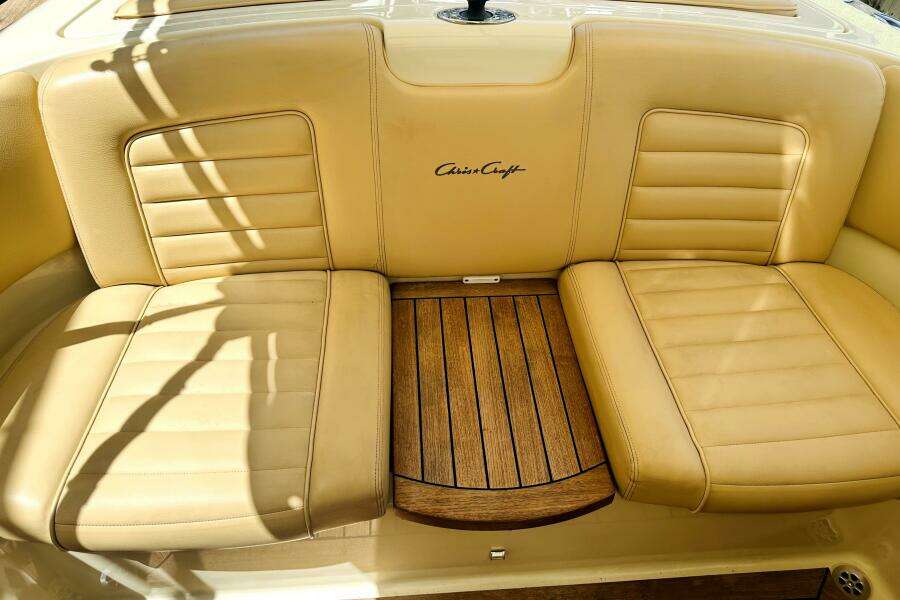 Luxurious tan leather seating on 2013 Chris-Craft Corsair 22 boat with wooden accents.