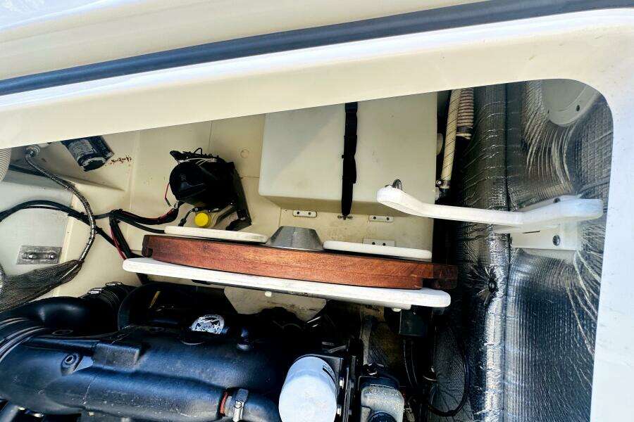 Engine compartment of a 2013 Chris-Craft Corsair 22 boat, showcasing mechanical components.