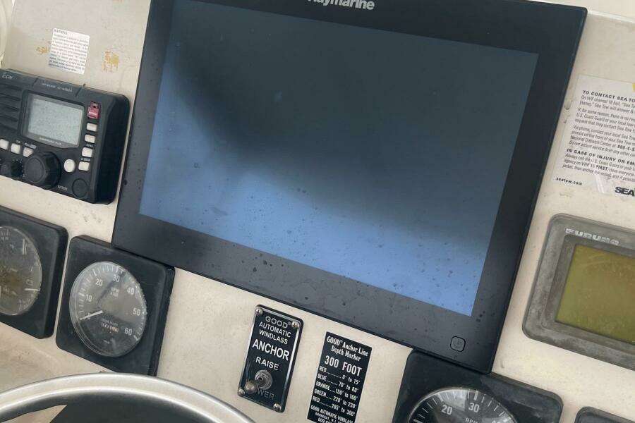 Control panel of a 2001 Pursuit 3000 Offshore boat with navigation and communication equipment.