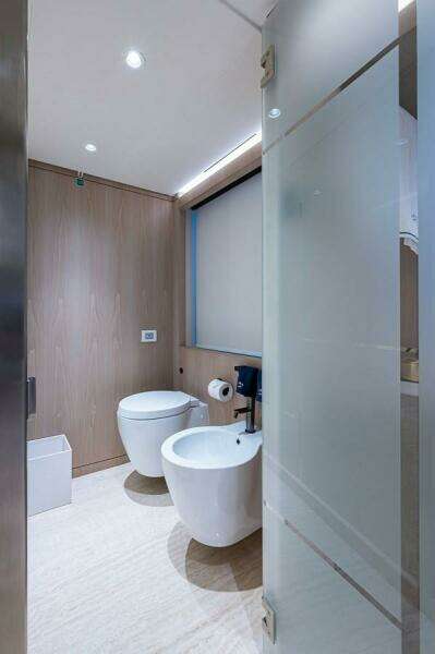 Modern bathroom with toilet and bidet on Majesty 140 yacht, 2020 model.