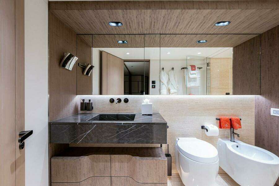 Luxurious bathroom on 2020 Majesty 140 yacht with modern fixtures and elegant design.