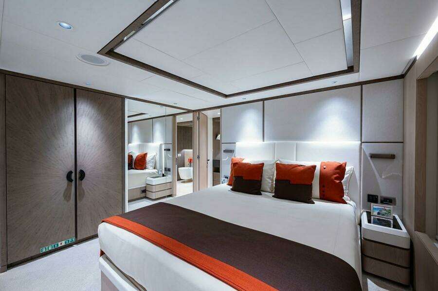Luxurious bedroom interior on 2020 Majesty 140 yacht with modern design and elegant decor.