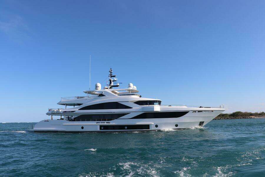 Luxury Majesty 140 yacht cruising on open sea, 2020 model, under clear blue sky.