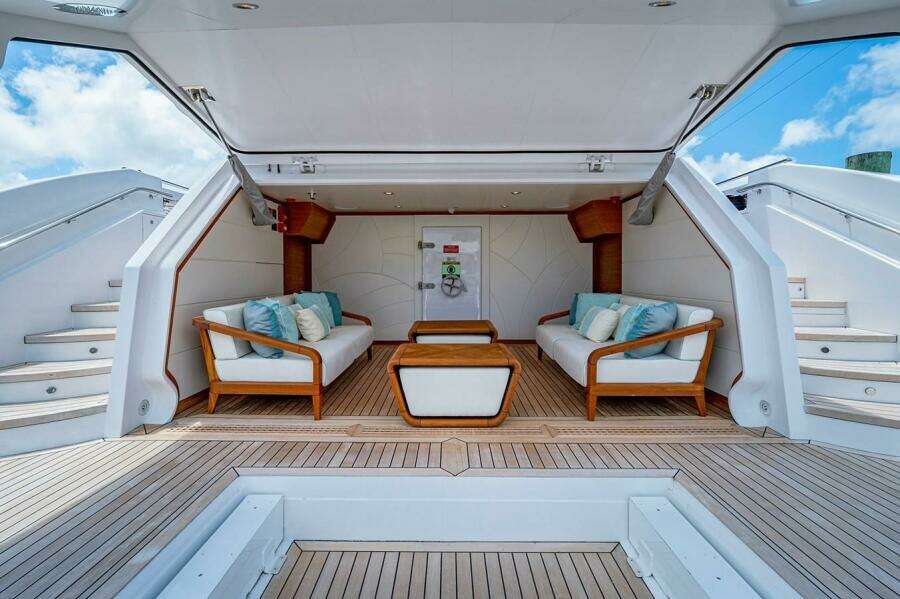 Luxurious 2020 Majesty 140 yacht interior with elegant seating and wooden accents.