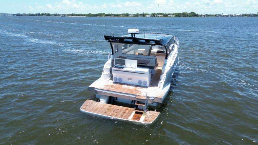 Luxury yacht "Real 40 HT" cruising on open water, 2025 model.