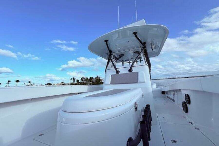 2019 Freeman 34 boat with sleek design, open deck, and clear blue sky background.