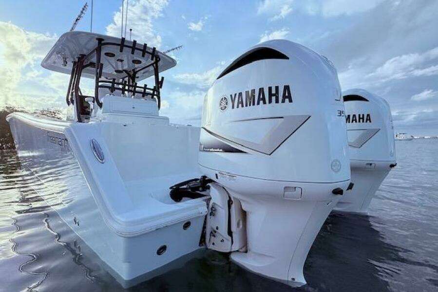 2019 Freeman 34 boat with twin Yamaha outboard engines on calm water.