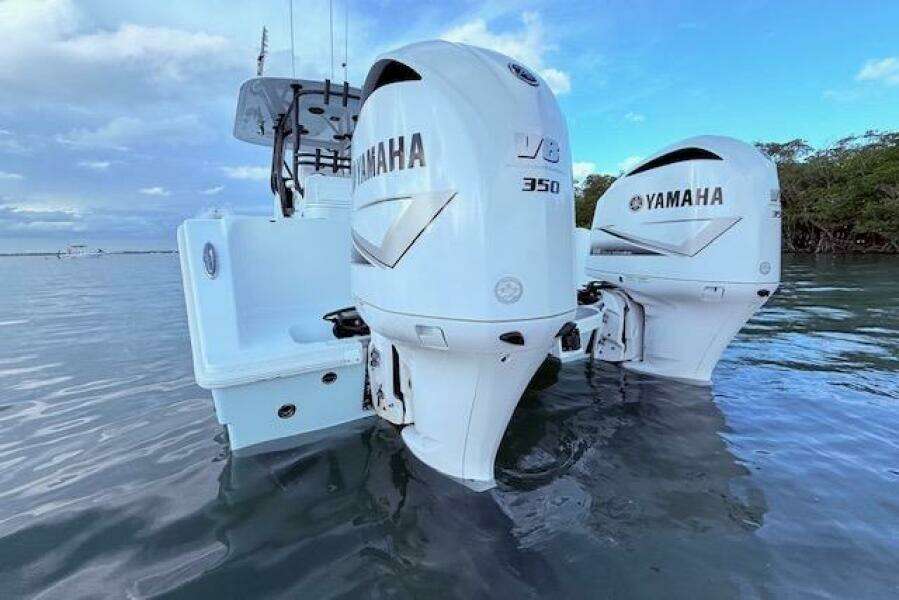 2019 Freeman 34 boat with twin Yamaha V8 350 outboard engines on water.