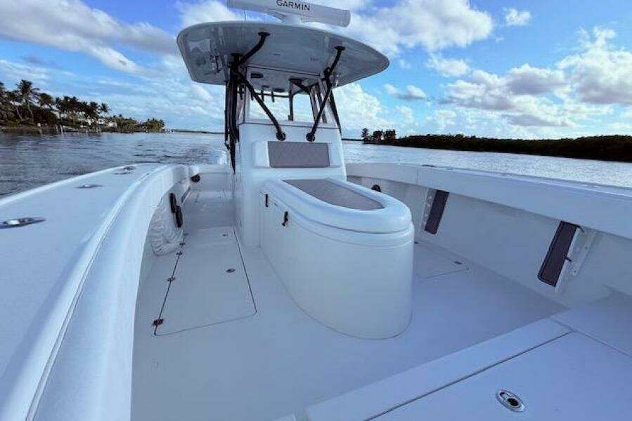 2019 Freeman 34 boat with spacious deck, sleek design, and clear blue sky backdrop.