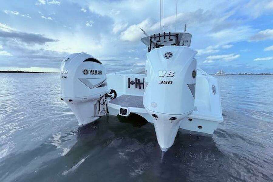 2019 Freeman 34 boat with twin Yamaha V8 350 engines on calm water.