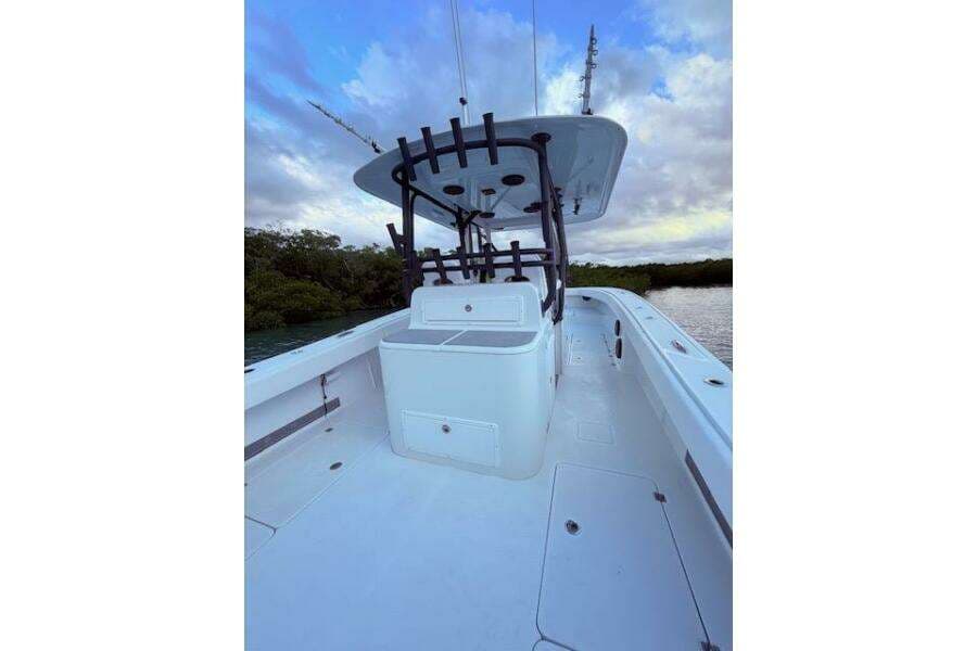 2019 Freeman 34 boat deck with center console, under a cloudy sky.