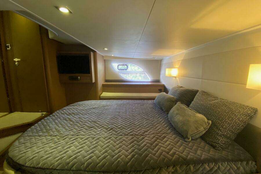 Luxurious cabin interior of 2014 Beneteau Gran Turismo 44 yacht with cozy bedding.