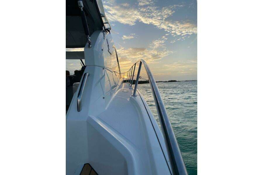 2014 Beneteau Gran Turismo 44 yacht at sunset on the ocean.
