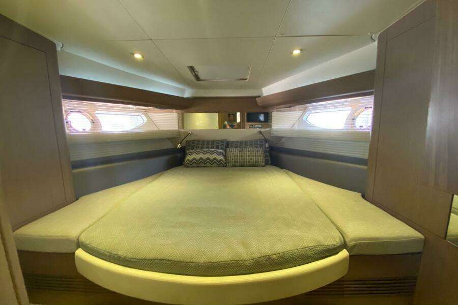 Luxurious cabin interior of 2014 Beneteau Gran Turismo 44 yacht with cozy bedding.