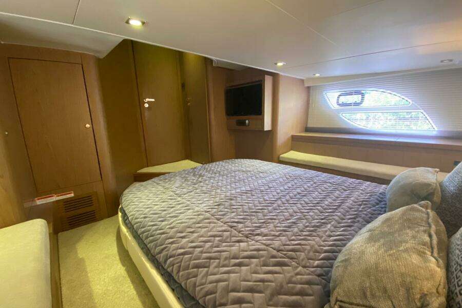 Luxurious cabin interior of 2014 Beneteau Gran Turismo 44 yacht with cozy bedding.