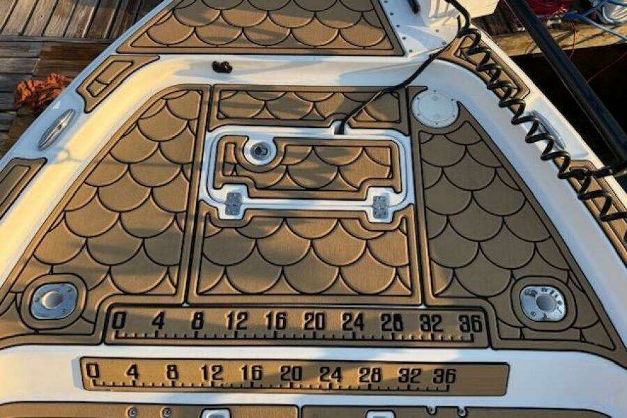 2018 Sea Hunt BX 25 FS boat deck with fish scale pattern and measurement markings.