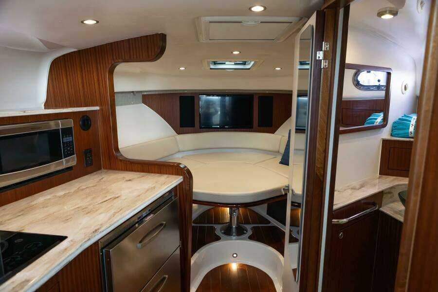 Pursuit 38 - TRACKER - Cabin View of Galley, Berth, and Head