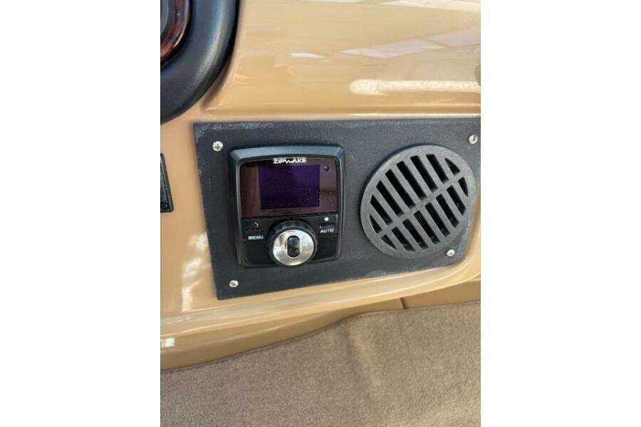 Control panel on 2004 Carver 466 Motor Yacht with Zipwake system and speaker grille.